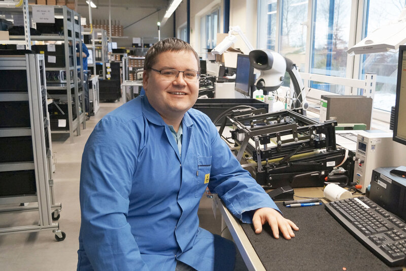 Christian Müller at a test station in electronics manufacturing